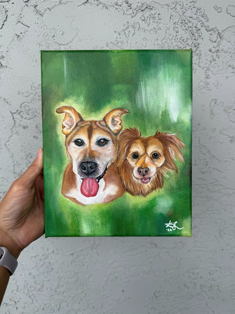Hand-painted portrait of two dogs together on canvas with a green background