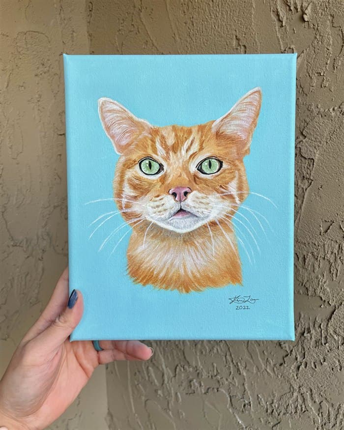 Example canvas portrait — an orange tabby cat on a light blue background